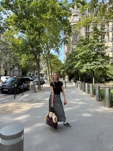 Walking down a tree-lined street in Paris